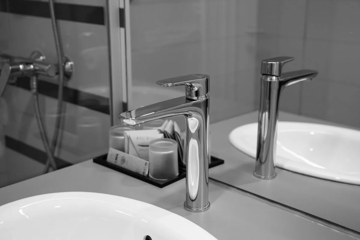 Illustrative installed residential basin and chrome faucet